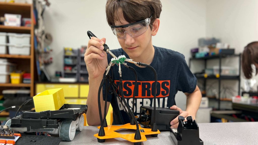 High school student using makerspace