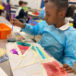 Elementary art student painting